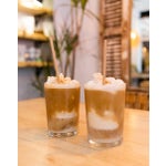 Two blended coffees on a table in a cafe.
