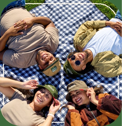 Torani assorted hats worn by a group of people outside 