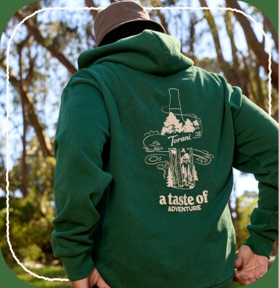 Torani "Taste of adventure" green hoodie with cream text and imagery 