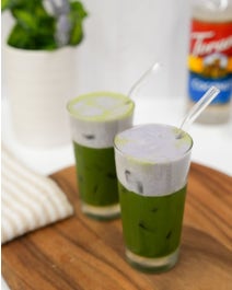 Matcha Latte with Ube Cold Foam on a table.