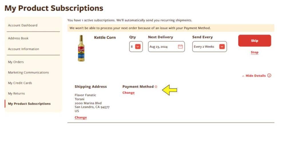 arrow pointing to change in red text under payment method